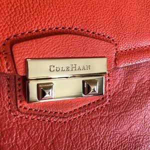 Cole Haan Izzie leather clutch in Orange Pop